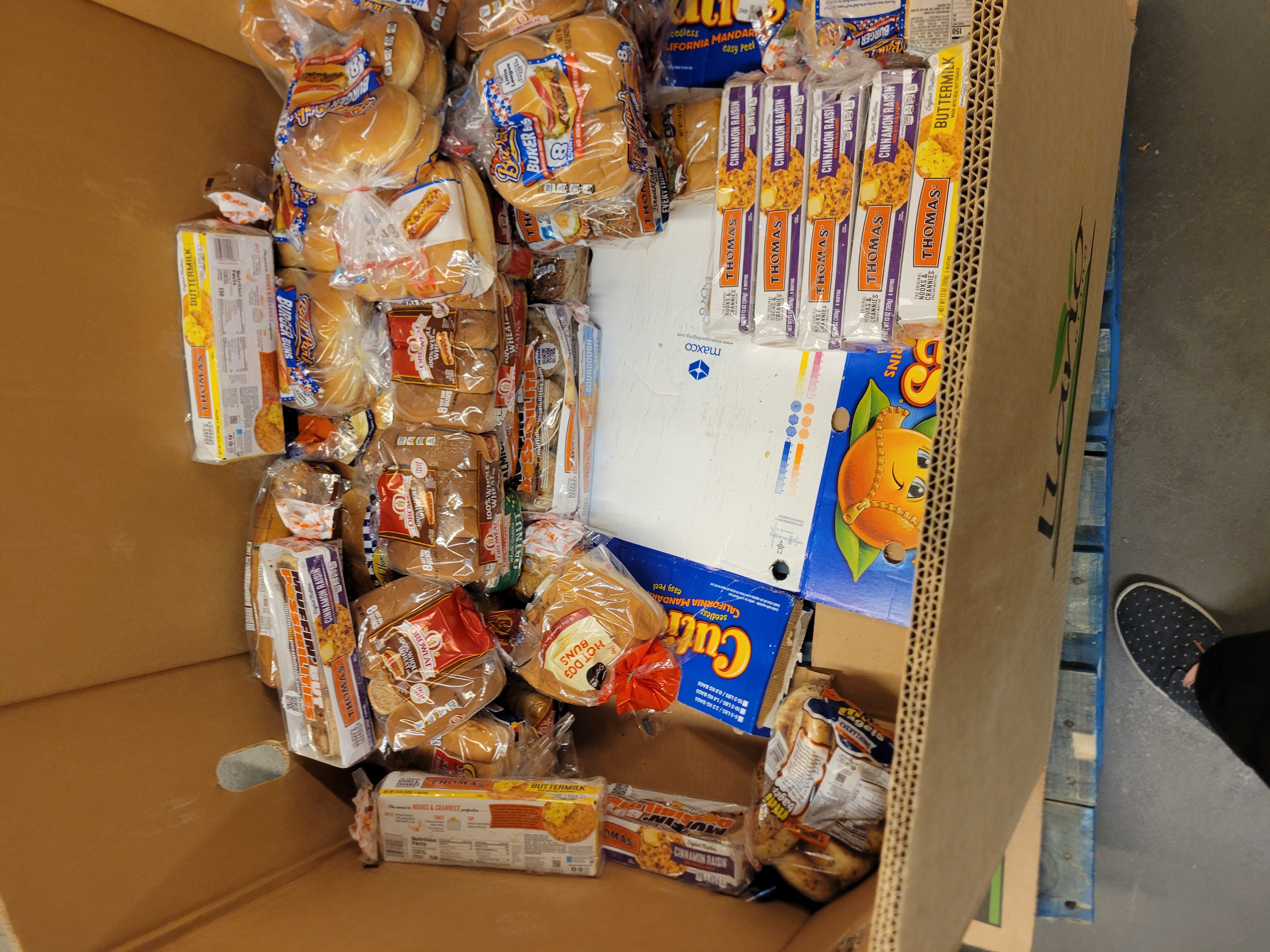 Cardboard container filled with bread,